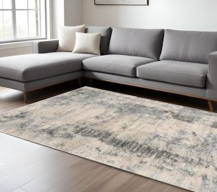 8' X 10' Ivory Blue Machine Woven Abstract Indoor Area Rug