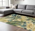 8' X 10' Ivory Teal Hand Tufted Tropical Leaves Indoor Area Rug