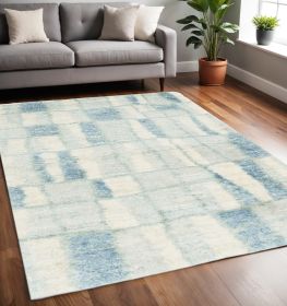 5' X 8' Ivory Blue Machine Woven Abstract Blocks Indoor Area Rug