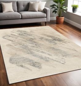 5' X 8' Ivory Grey Machine Woven Abstract Brushstrokes Indoor Area Rug