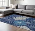 7' X 10' Blue And Ivory Floral Power Loom Area Rug