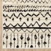 7' X 9' Ivory And Black Eclectic Patterns Indoor Area Rug