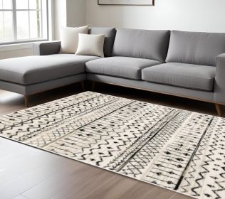 7' X 9' Ivory And Black Eclectic Patterns Indoor Area Rug
