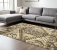 7' X 10' Tan And Gold Central Medallion Indoor Area Rug